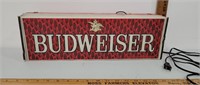 Budweiser lighted sign.  Metal.base with plastic