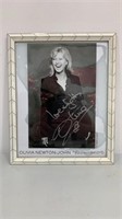 Autographed Olivia Newton -John photo framed.