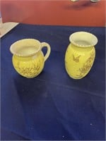 2 yellow small pitchers