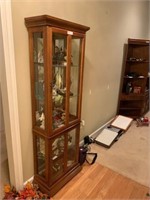 LIGHTED CURIO CABINET WITH FOUR DOORS,