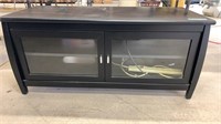 Television stand, with glass door storage, and