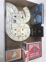 Deal you in? Cribbage board with several decks of