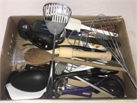 Variety of kitchen utensils such as a whisk,