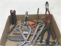 Assortment of pliers, box cutters, wrenches and