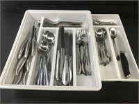 Full set and more of stainless steel cutlery.