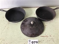 CAST-IRON SKILLETS AND LIDS, ONE GRISWOLD