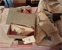 Box of Table Cloths and Doilies.