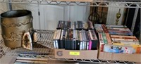 SHELF LOT OF DVDS, VCRS, SAD IRON
