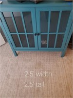 Teal cabinet w/ doors