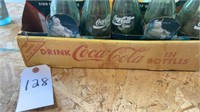 Coca- Cola Bottles And Flat