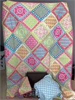 Queen-size quilt with sheets, shames, and basket