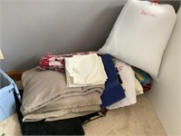 Assorted blankets, rugs, and towels