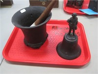 iron mortar and pestle and a figural hand bell