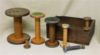 Primitive Wooden Spools in Fruit Crate.