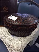 Small brown wicker covered basket
