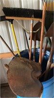 Misc lawn tools and shovels in barrel