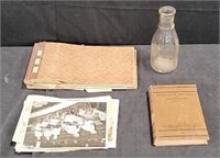 Box of vintage pictures, glass bottle, book, etc.