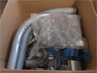 Box of Metal Piping with Clamps