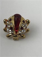 Golden and red ladybug with a rhinestone lapel pin