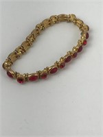 Red rhinestone with a gold color bracelet