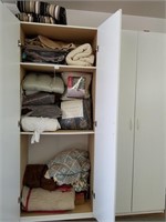 651- Large Lot Of Bedding In Cabinet