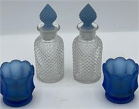 (2) Small Bottles With Stoppers And Candle Holders