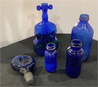 Lot of five blue glass items - jars, bottle,