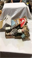 Signs, pictures, dolls, crystal dishes
