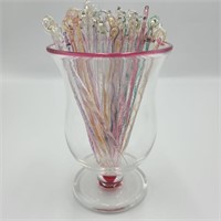 Pink Rimmed Glass of Stir Sticks