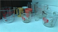Pyrex glass measuring cups, sauce cups