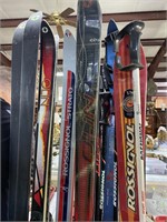 Ski rack with 6 sets Rossingnol & Olin skis, and