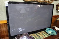 LG 50” flat screen TV w/ remote, mannual & DVD