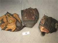 Three Leather Baseball Gloves