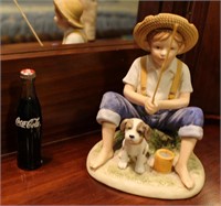 Boy fishing figurine w a glass bottle of coke