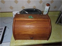 bread storage box, Crock-Pot, can opener and