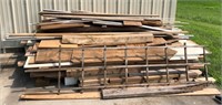 Pile of Lumber Outside of Garage