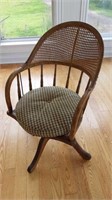 Vintage caned swivel chair
