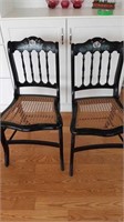 Two vintage caned chairs