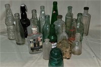 Glass bottles and insulator in plastic crate