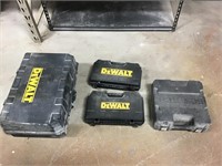 Four empty Dewalt cases