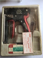 staple gun in case with box of staples