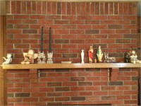 Angels and various items on fire place mantel