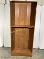 Light brown laminated pressed wood bookshelf