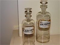 2 Vintage glass bottles tallest is 10"