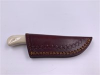 Damascus bladed knife with bone scales leather she