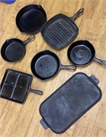 Box of cast iron cookware- 1 pan damaged