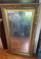 Beautiful gold framed mirror with heavily aged