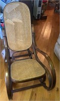 Caned rocker with 2 pillows