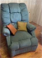 Teal recliner with pillows