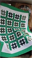 Green and white quilt